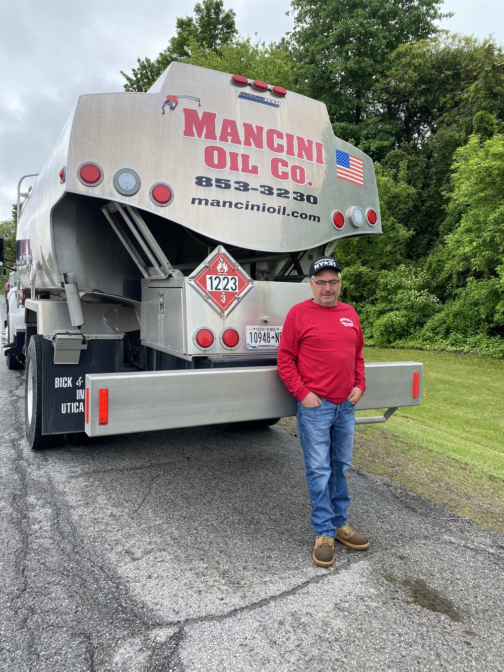 Mancini Oil Co. delivery driver with a tanker truck